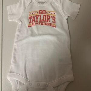 White Baby Onesie with Red and Orange Print